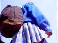 The pleated skirt of this schoolgirl is so wide that when the wind blows it lifts up uncovering her pink panty windblown upskirt!